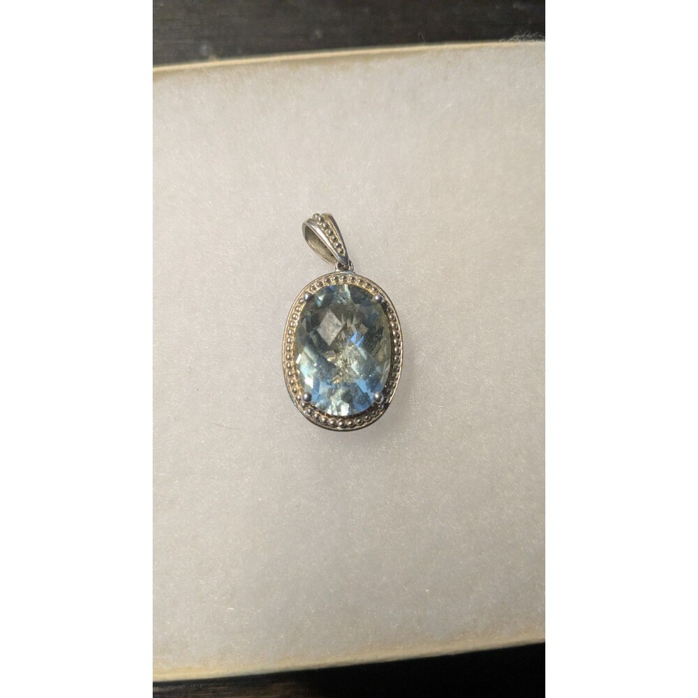925 sterling Marked Light Blue Stone gold and silver colored pendant